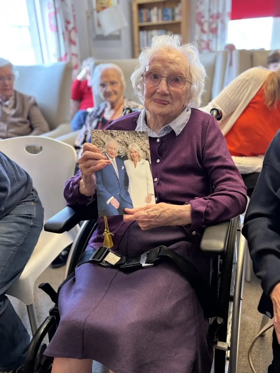 Martha holding her card from the King and Queen on her 100th birthday at Kynnaird House Care Home