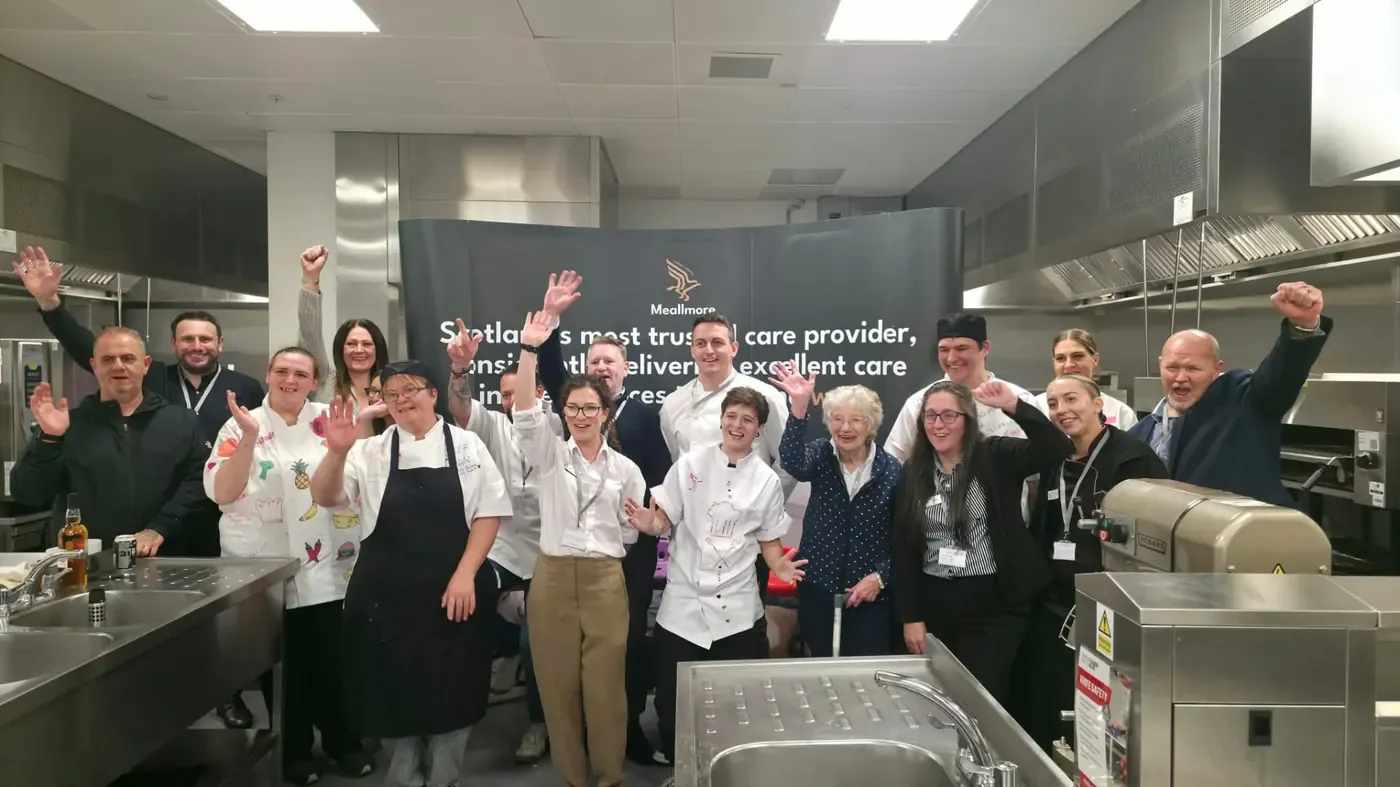 Jody Marshall, Group Catering and Hospitality Manager at Meallmore, far right, celebrating with chefs, colleagues and a resident at the Meals Means More competition