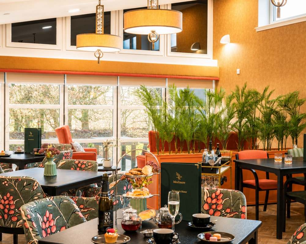 The light-filled cafe and lounge area at Kelvinside Manor Care Home in Glasgow