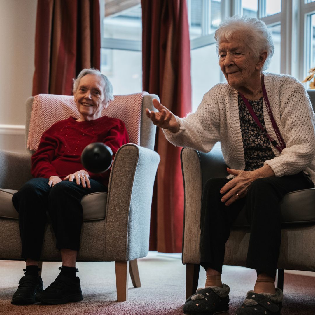 Residents enjoying a creative activity at a Meallmore care home