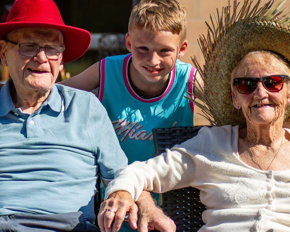 Residents and colleagues enjoying a summer event together at Mearns House Care Home in Newton Mearns